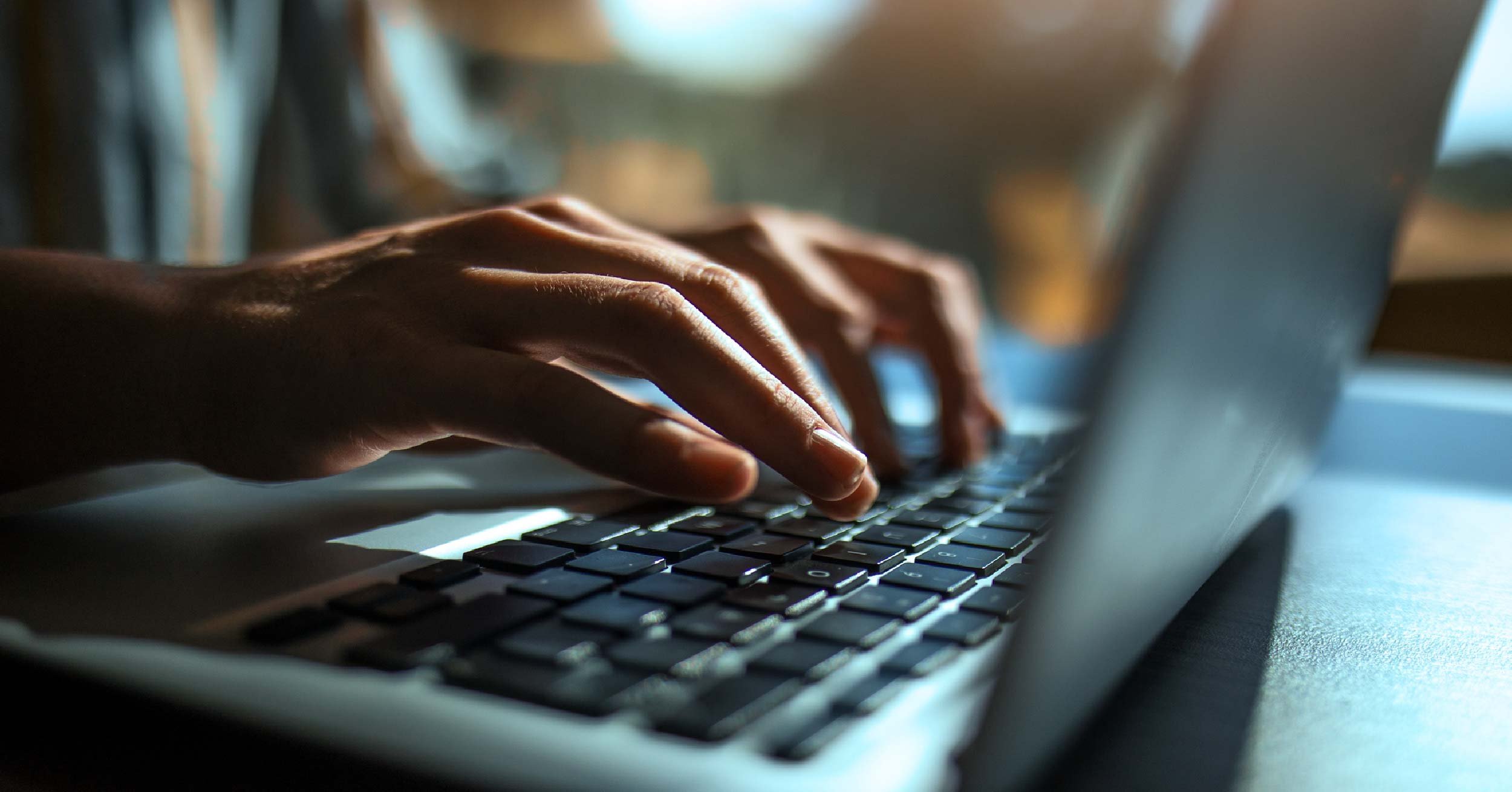 man using a laptop for SEO 