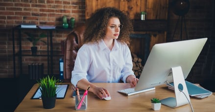 Woman working on computer.