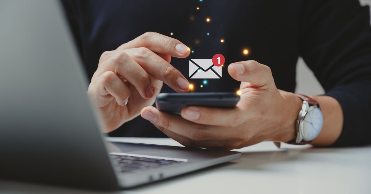 Man answering most common email marketing questions on mobile device