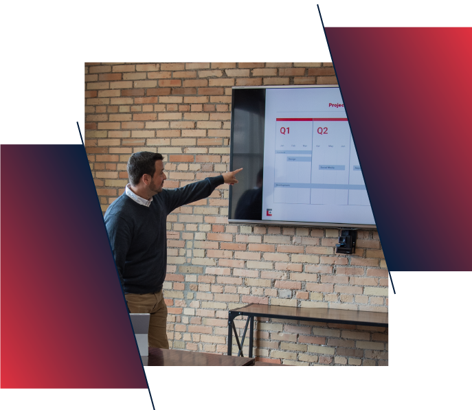 A guy presenting quarterly plans on big screen A guy presenting quarterly plans on big screen